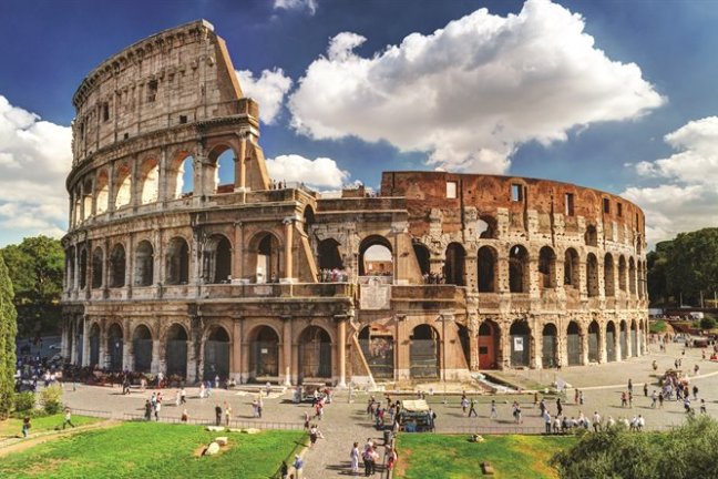 a group of people in front of a large building with Colosseum in the background